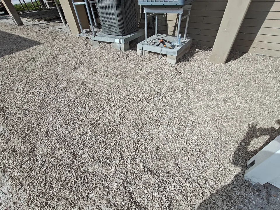 Completed coastal shell ground cover around AC units Florida