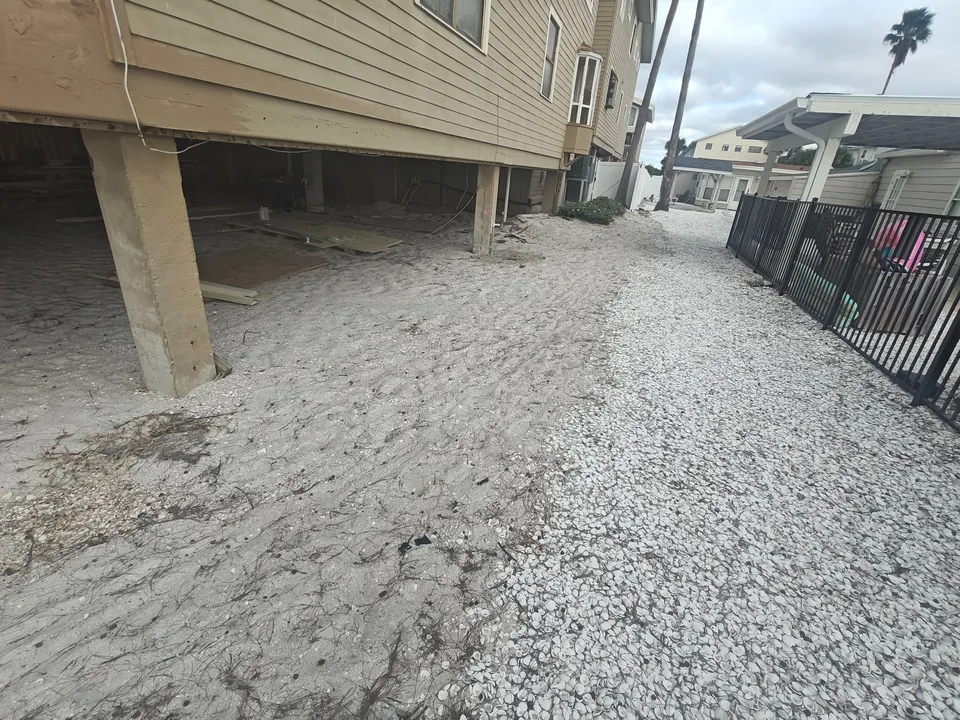 Sandy coastal property before shell ground cover installation Florida